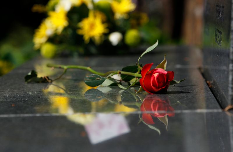&copy; Reuters. A rose sits on the base of the main headstone in the Lockerbie Air Disaster memorial garden in Lockerbie, Scotland