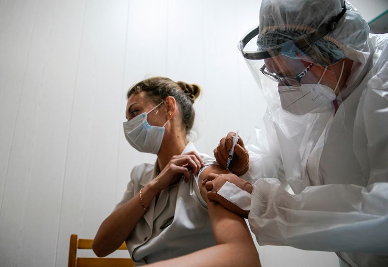 &copy; Reuters. A medic of the regional hospital receives  Russia&apos;s &quot;Sputnik-V&quot; vaccine shot against the coronavirus disease (COVID-19) in Tver