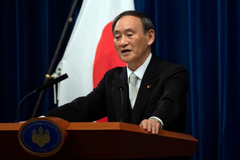 &copy; Reuters. FILE PHOTO: Yoshihide Suga speaks during a news conference following his confirmation as Prime Minister of Japan in Tokyo