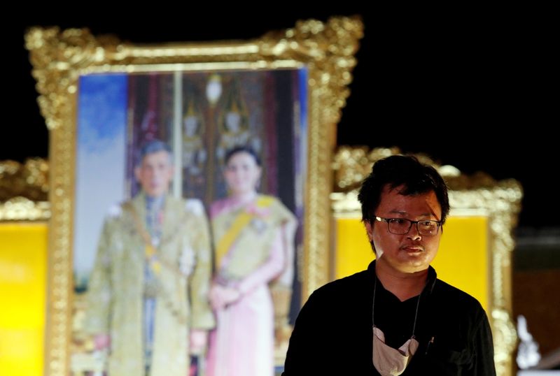 &copy; Reuters. FILE PHOTO: Anon Nampa, one of the leaders of recent anti-government protests, is seen near a portrait of Thailand&apos;s King Maha Vajiralongkorn and Queen Suthida after a rally in Bangkok