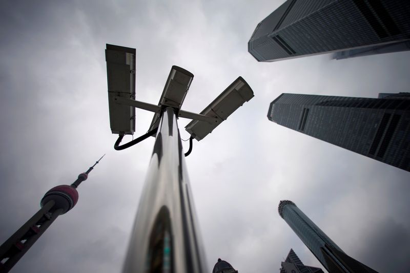 &copy; Reuters. Surveillance cameras are seen at Lujiazui financial district in Pudong