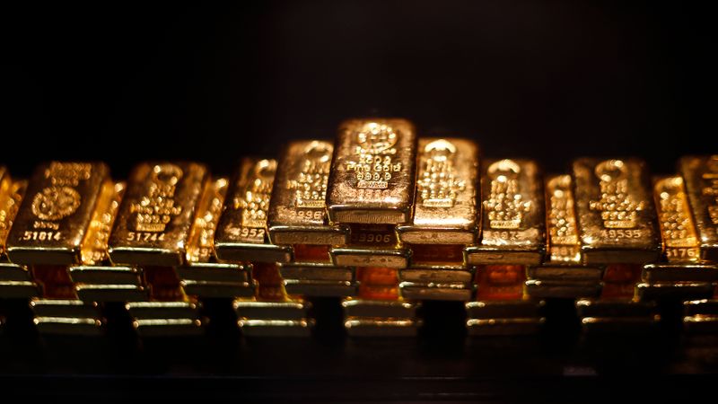 &copy; Reuters. Gold bars are stacked at a safe deposit room of the ProAurum gold house in Munich