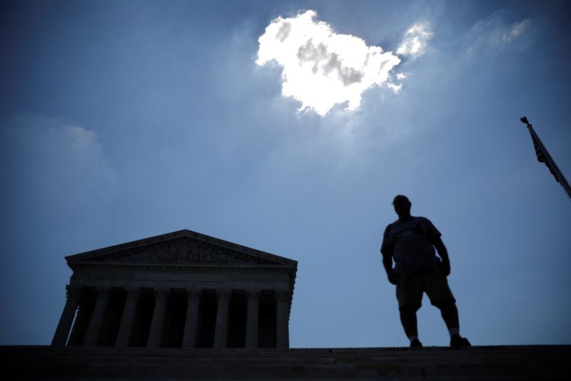 &copy; Reuters. A man stands outside the U.S. Supreme Court in Washington
