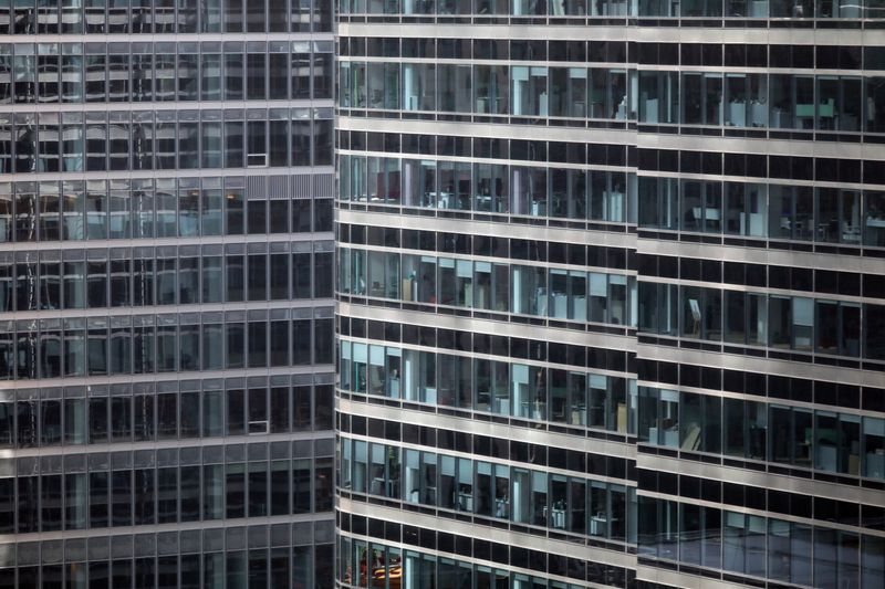 &copy; Reuters. S&amp;P office is seen at right in Canary Wharf in London