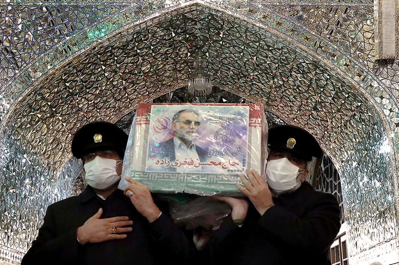 &copy; Reuters. Servants of the holy shrine of Imam Reza carry the coffin of Iranian nuclear scientist Mohsen Fakhrizadeh, in Mashhad