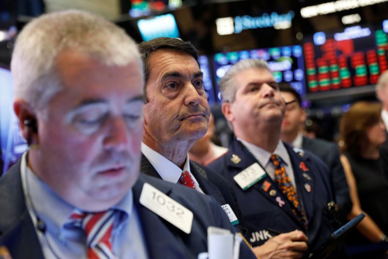 &copy; Reuters. Traders work on floor of New York Stock Exchange (NYSE) after opening bell in New York