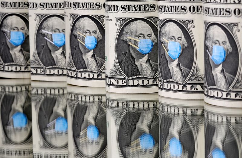 © Reuters. George Washington is seen with printed medical mask on the one Dollar banknotes in this illustration taken