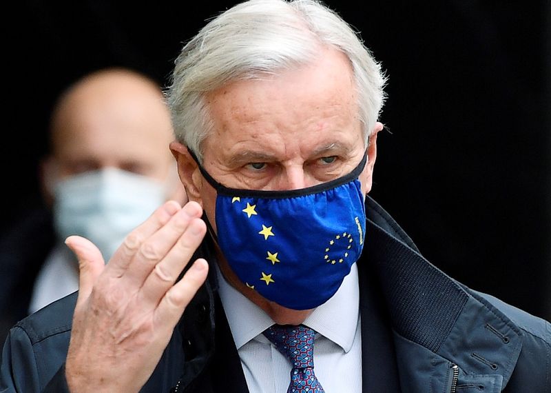 © Reuters. FILE PHOTO: The European Union's chief Brexit negotiator, Michel Barnier, wearing a face mask as he walks to Brexit trade negotiations in London