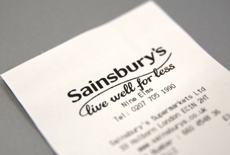 © Reuters. FILE PHOTO: A discarded till receipt lies on a table at a Sainsbury's store in London