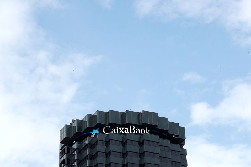 &copy; Reuters. FILE PHOTO: CaixaBank&apos;s logo is seen on top of the company&apos;s headquarters in Barcelona