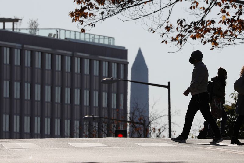 &copy; Reuters. Pedestrians cross Connecticut Avenue amid COVID-19 pandemic in Washington