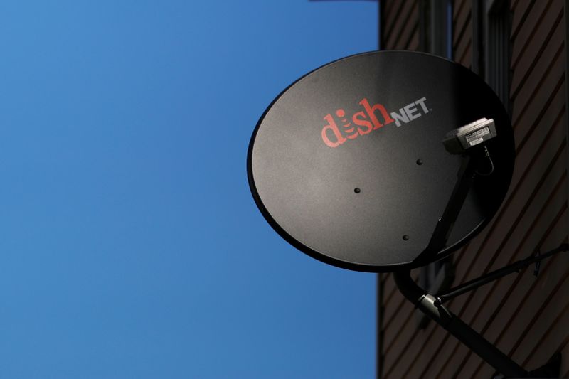 &copy; Reuters. A Dish Network receiver hangs on a house in Somerville