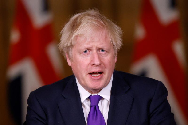 &copy; Reuters. FILE PHOTO: Britain&apos;s PM Johnson attends a news conference in London