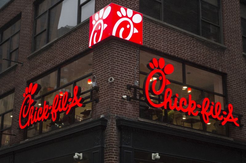 © Reuters. A franchise sign is seen above a Chick-fil-A freestanding restaurant after its grand opening in Midtown, New York