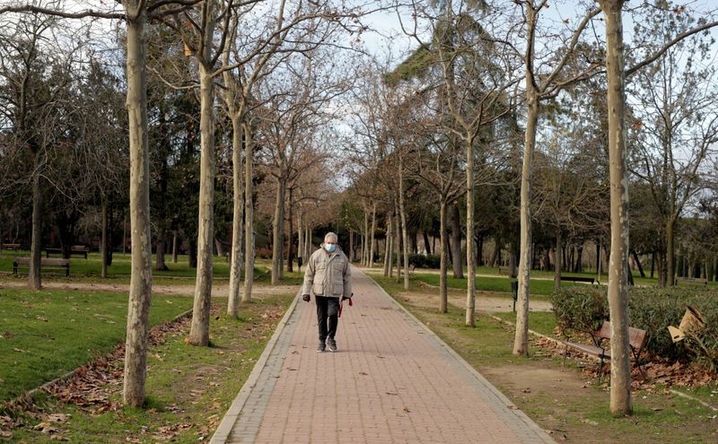 &copy; Reuters. Man walks in a park in Madrid