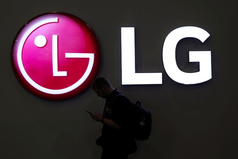 &copy; Reuters. FILE PHOTO: A man walks past an LG logo at the Mobile World Congress in Barcelona