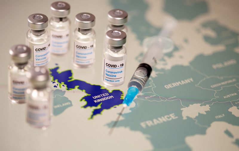 &copy; Reuters. FILE PHOTO: Vials labelled &quot;COVID-19 Coronavirus-Vaccine&quot; and medical syringe are placed on the European Union map in this picture illustration