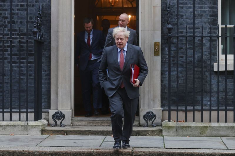 &copy; Reuters. Britain&apos;s Prime Minister Boris Johnson walks outside Downing Street, in London