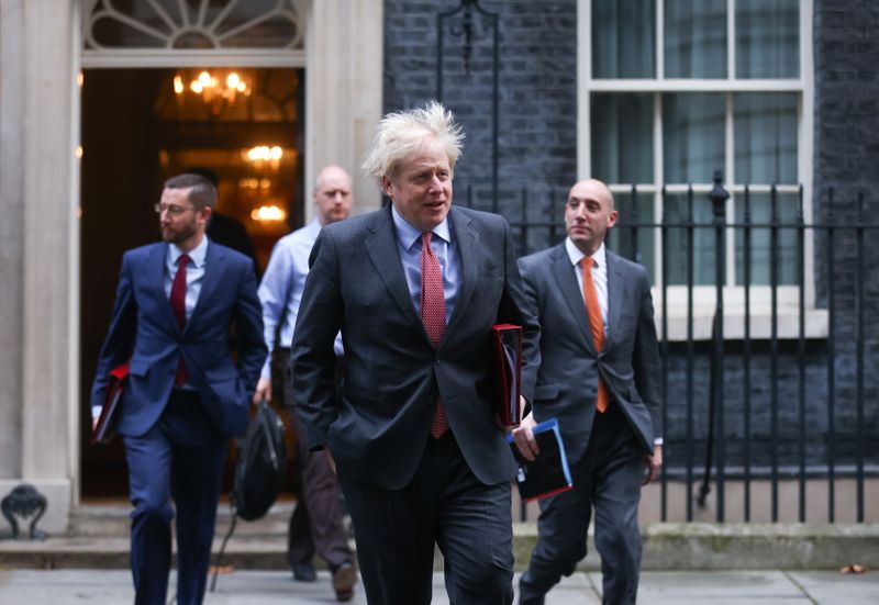&copy; Reuters. Britain&apos;s Prime Minister Boris Johnson walks outside Downing Street, in London