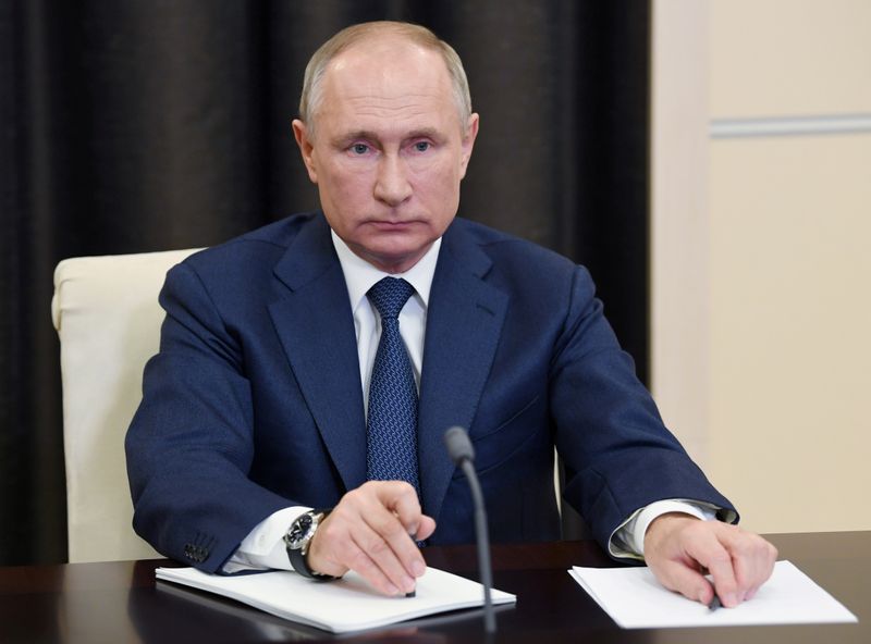 &copy; Reuters. FILE PHOTO: Russian President Putin attends a conference via a video link outside Moscow