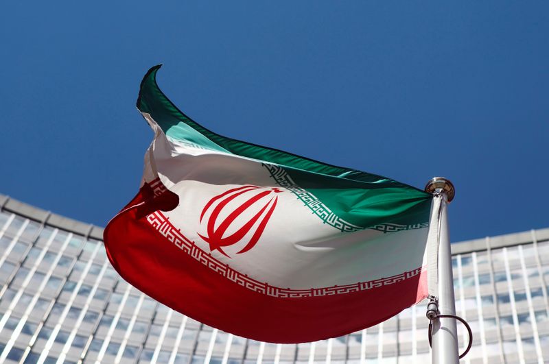 © Reuters. FILE PHOTO: An Iranian flag flutters in front of the UN headquarters in Vienna