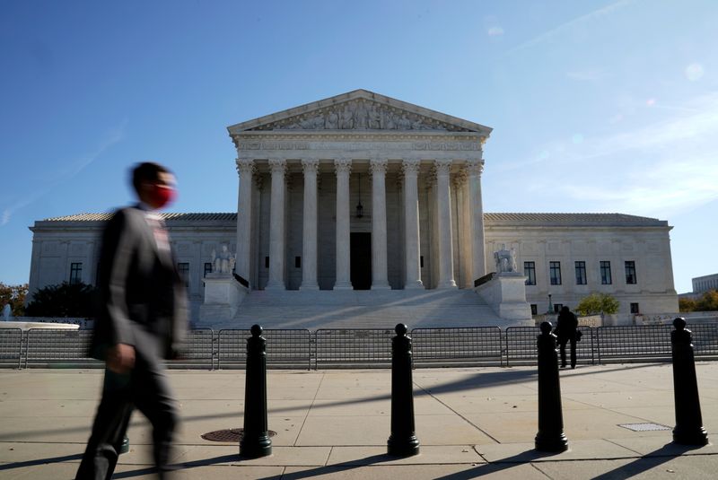 &copy; Reuters. FILE PHOTO: A man walks past the U.S. Supreme Court building in Washington