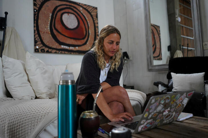 &copy; Reuters. FILE PHOTO: Camila Ginevra, an Argentine interior designer who recently moved to Uruguay, works at her home in La Barra