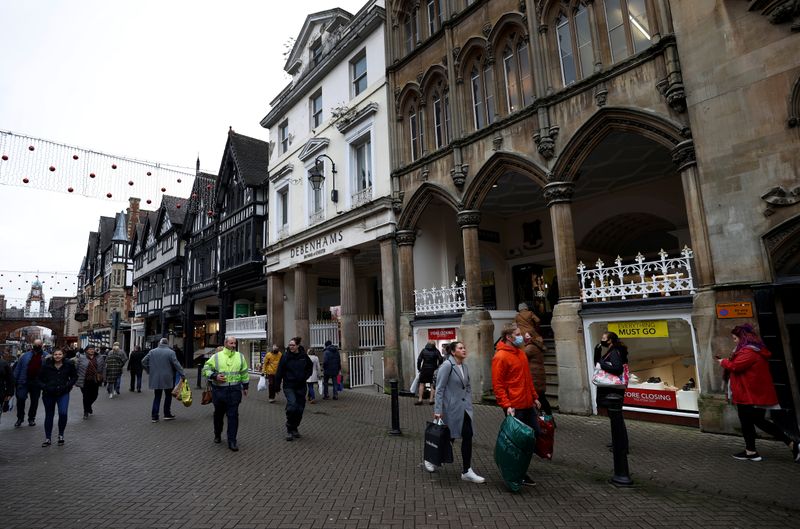 &copy; Reuters. Shoppers walk past a Debenhams store in Chester, Britain