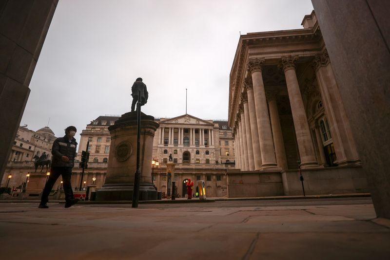 &copy; Reuters. FILE PHOTO: A pedestrian walks past the Bank of England, in London
