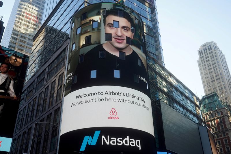 &copy; Reuters. FILE PHOTO: The Nasdaq market site displays an Airbnb sign featuring CEO Brian Chesky on their billboard on the day of their IPO in Times Square