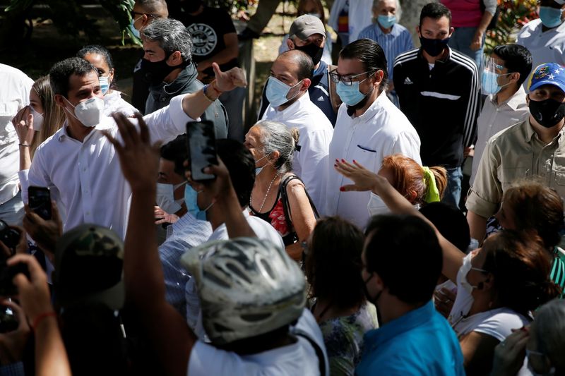 &copy; Reuters. Opposition leader Juan Guaido greets supporters during a visit to a voting center, in Caracas