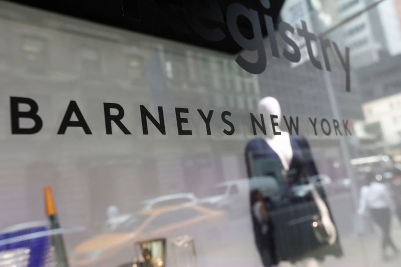 © Reuters. The Barneys New York sign is seen in a display window outside the luxury department store in New York