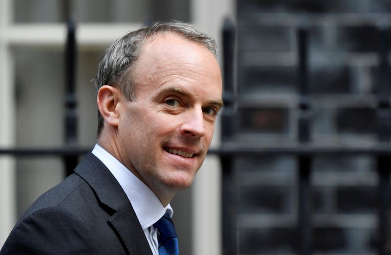 &copy; Reuters. FILE PHOTO: Britain&apos;s Foreign Affairs Secretary Dominic Raab walks outside Downing Street in London
