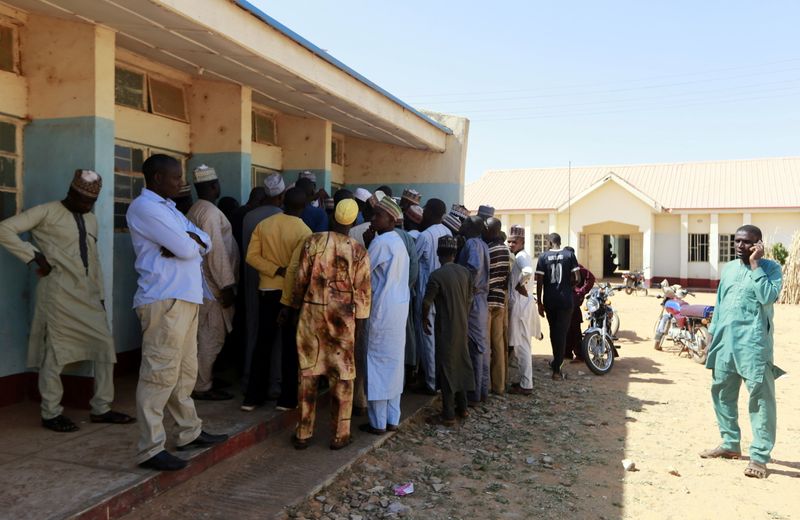 © Reuters. Parents gather during a meeting at the Government Science school after gunmen abducted students in Kankara