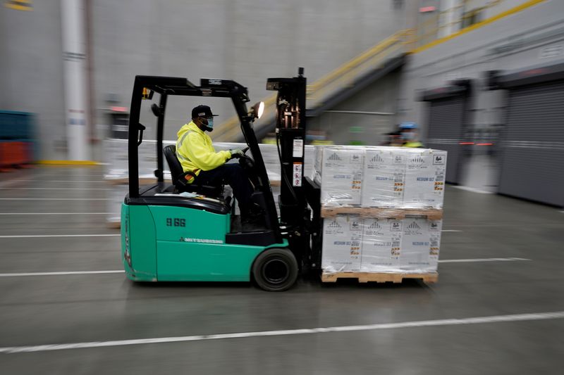 &copy; Reuters. Boxes containing the Pfizer-BioNTech COVID-19 vaccine are prepared to be shipped at the Pfizer Global Supply Kalamazoo manufacturing plant in Portage