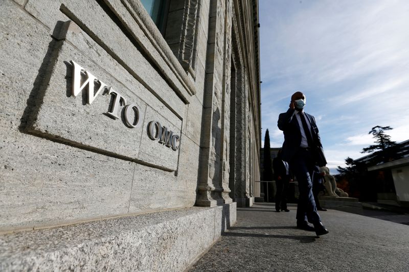 &copy; Reuters. FILE PHOTO: A delegate arrives before a meeting at the World Trade Organization (WTO) in Geneva