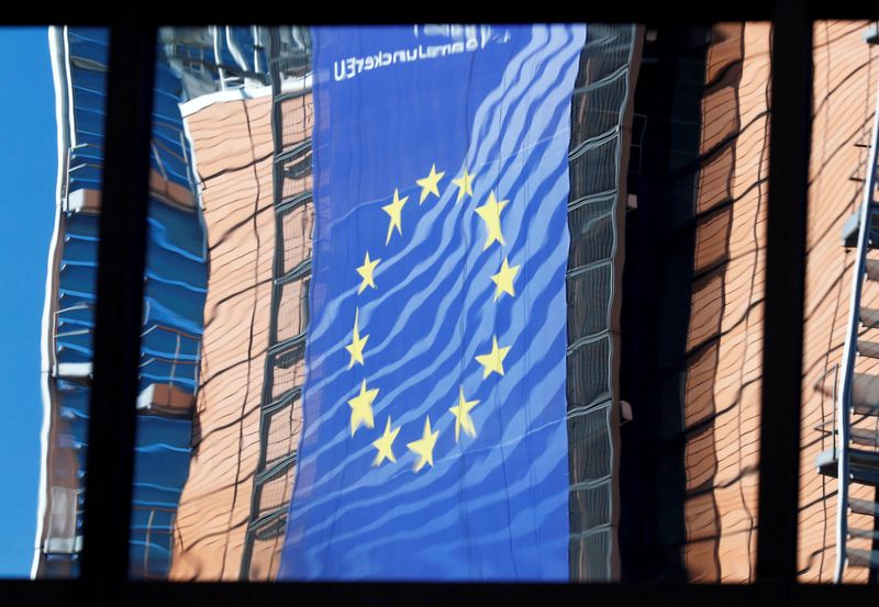 &copy; Reuters. FILE PHOTO: The facade of the EU Commission headquarters is reflected in the windows of the EU Council building in Brussels