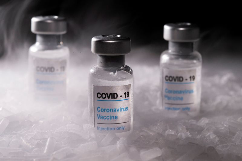 &copy; Reuters. FILE PHOTO: Vials labelled &quot;COVID-19 Coronavirus Vaccine&quot; are placed on dry ice in this illustration