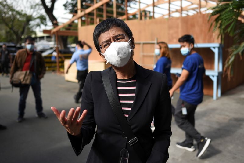 &copy; Reuters. Rappler CEO Maria Ressa speaks to the media outside a regional trial court before the arraignment in her second cyber libel case, in Makati City