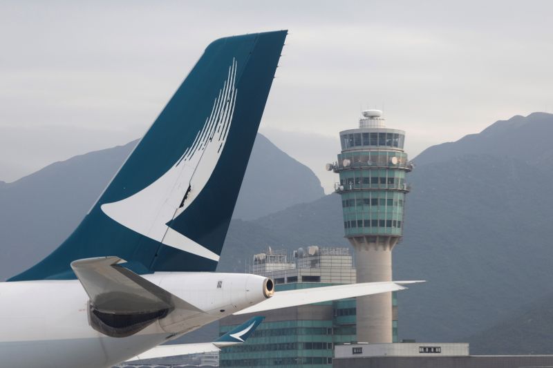 &copy; Reuters. FILE PHOTO:  An aircraft of Cathay Pacific is seen in front of air traffic control tower at the Hong Kong International Airport, Hong Kong