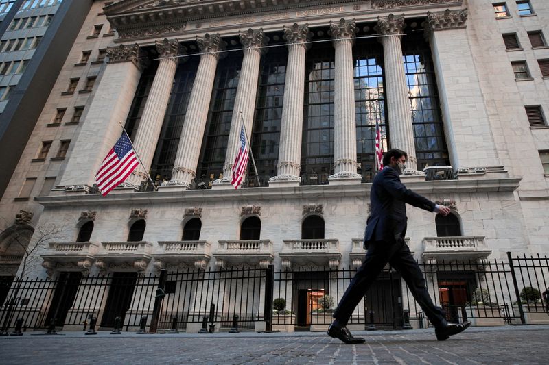 © Reuters. A man walks outside the NYSE in New York