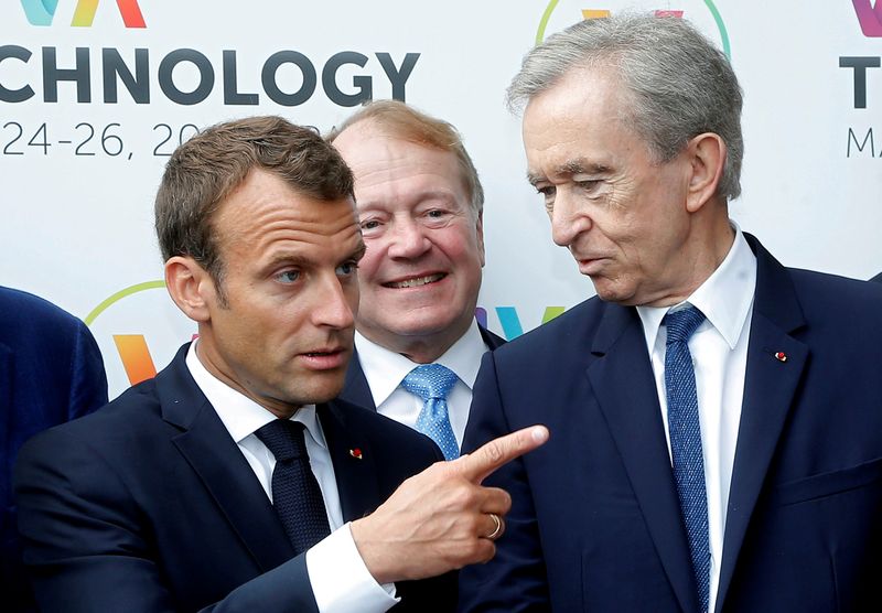 &copy; Reuters. FILE PHOTO: French President Emmanuel Macron talks with LVMH luxury group CEO Bernard Arnault at the Viva Tech start-up and technology gathering in Paris