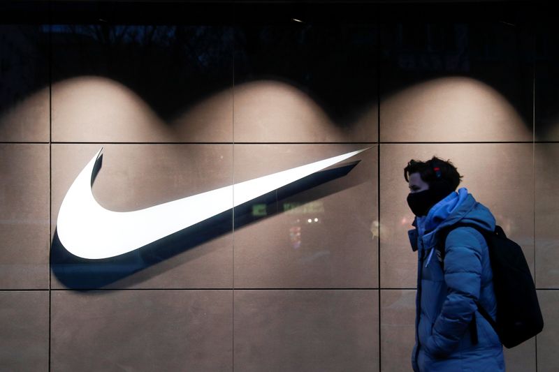&copy; Reuters. FILE PHOTO: A person walks past a Nike brand store in Kyiv