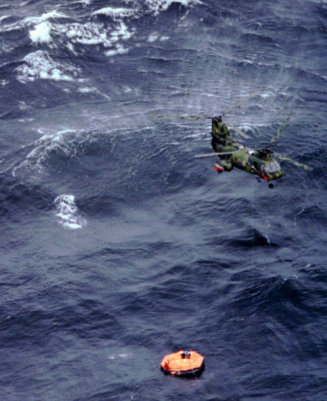 &copy; Reuters. FILE PHOTO: A helicopter circles an over turned lifeboat from the ferry Estonia, which sank in a storm off south..