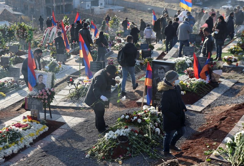 &copy; Reuters. People visit a military cemetery on the day of the Armenian nationwide mourning in Yerevan