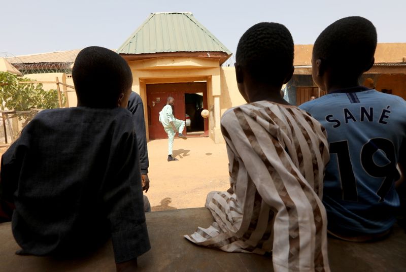 &copy; Reuters. A freed Nigerian schoolboy plays football as he returns home, after he was rescued by security forces, in Kankara