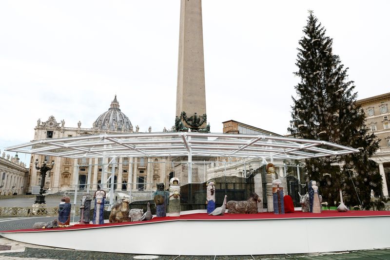 © Reuters. An astronaut figurine stands among the nativity scene display at the Vatican