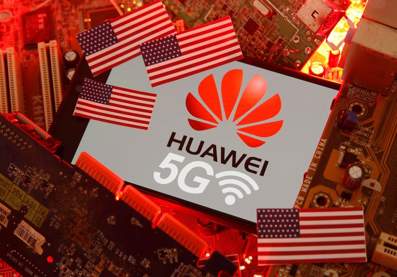 &copy; Reuters. The U.S. flag and a smartphone with the Huawei and 5G network logo are seen on a PC motherboard in this illustratio