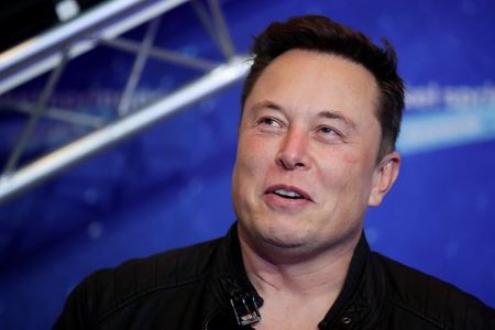 Tesla's Elon Musk asks about converting 'large transactions' to bitcoin By Reuters