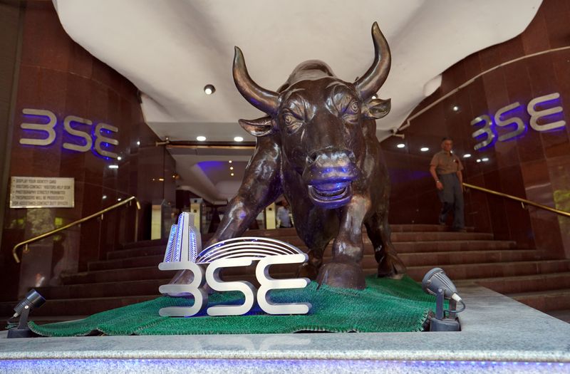 &copy; Reuters. FILE PHOTO: A man walks out of the Bombay Stock Exchange building in Mumbai, India